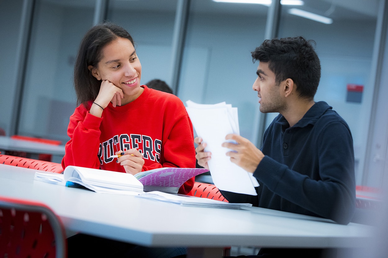 Two students engage in a peer study session